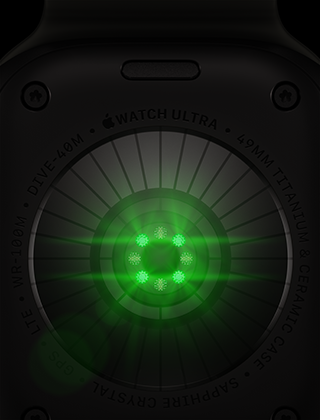 ブラックチタニウムケースのApple Watch Ultra 4の背面。複数の丸いセンサーが見えていて、緑色のLEDライトが光っている