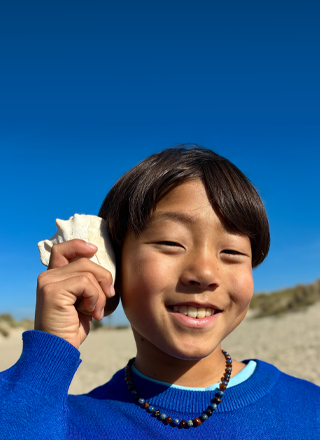 48MP Fusionカメラで撮影した写真。次世代のポートレート機能を使って人物の顔にフォーカスしている